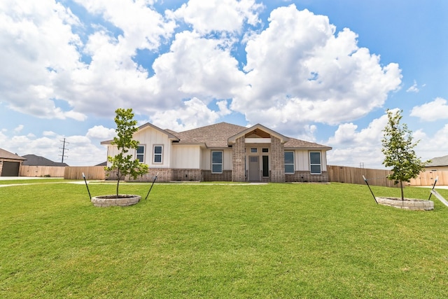 ranch-style house featuring a front lawn