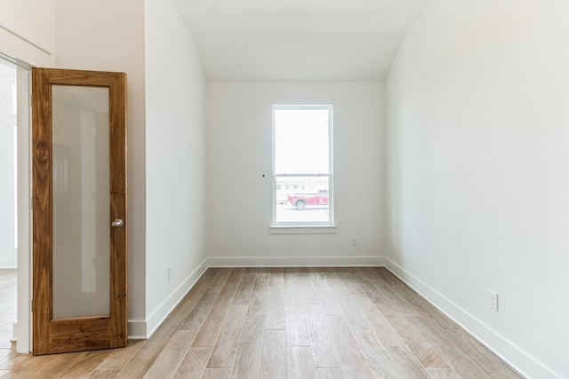 unfurnished room with light hardwood / wood-style floors