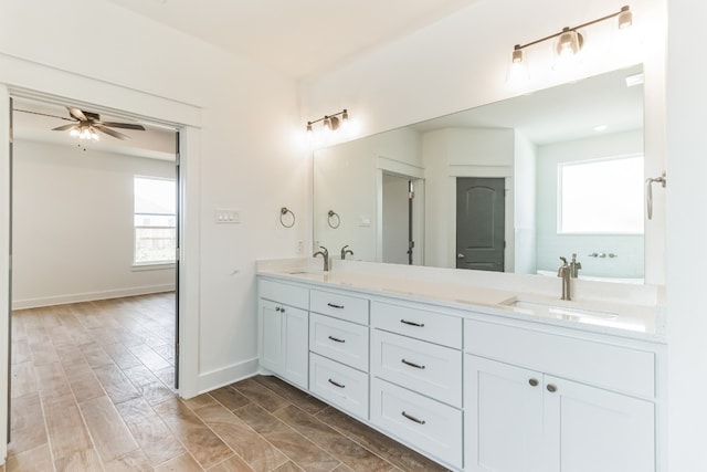 bathroom with vanity, a wealth of natural light, and ceiling fan