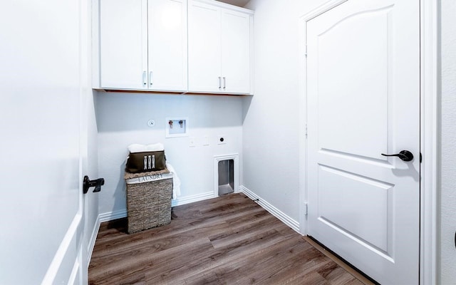 clothes washing area with electric dryer hookup, washer hookup, hookup for a gas dryer, cabinets, and hardwood / wood-style floors