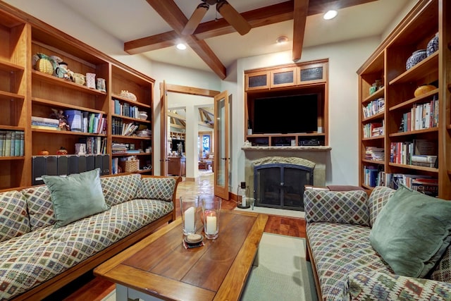 living room featuring coffered ceiling, ceiling fan, hardwood / wood-style flooring, and beamed ceiling