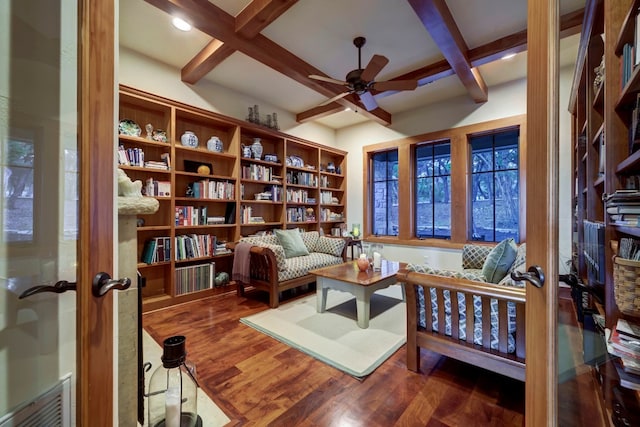 living area featuring french doors, dark hardwood / wood-style flooring, and beamed ceiling