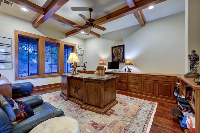 office area with coffered ceiling, dark hardwood / wood-style floors, ceiling fan, and beamed ceiling