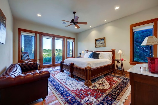 tiled bedroom with french doors, access to exterior, and ceiling fan