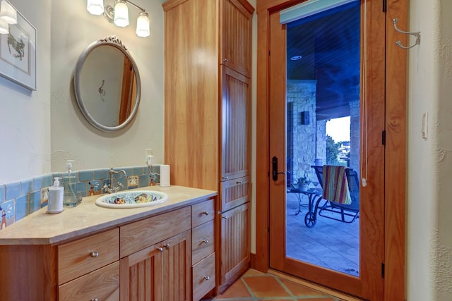 bathroom with tile floors and vanity