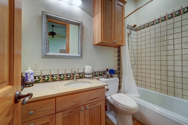 full bathroom featuring ceiling fan, toilet, oversized vanity, and shower / tub combo