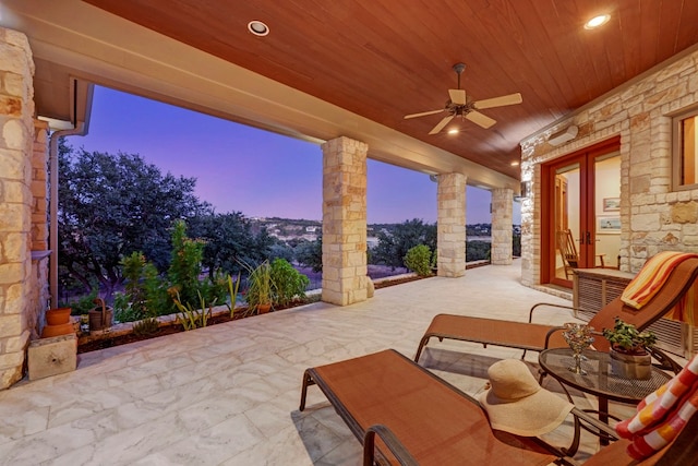 patio terrace at dusk with ceiling fan