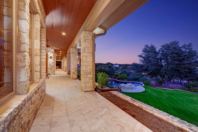 patio terrace at dusk with a yard