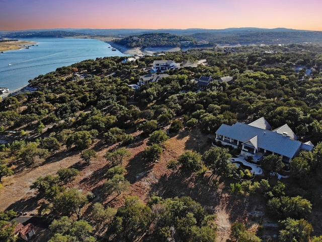 aerial view at dusk with a water view