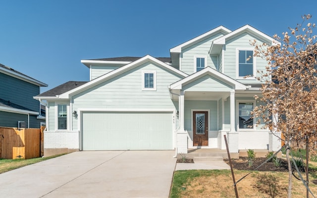 craftsman house featuring a porch and a garage