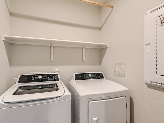 washroom featuring washer and clothes dryer