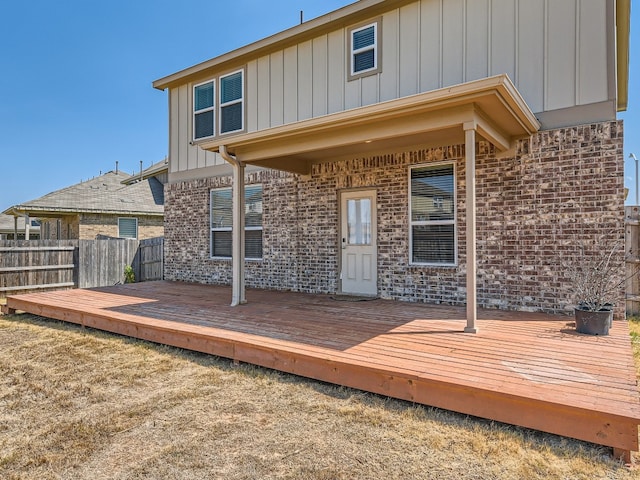 back of property with a wooden deck