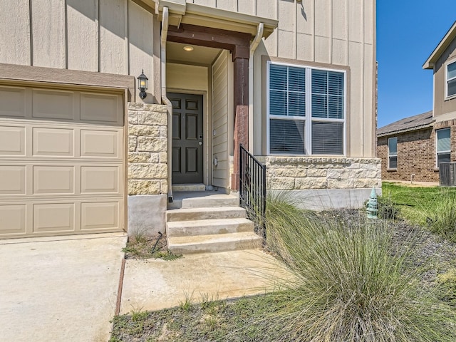 doorway to property featuring a garage