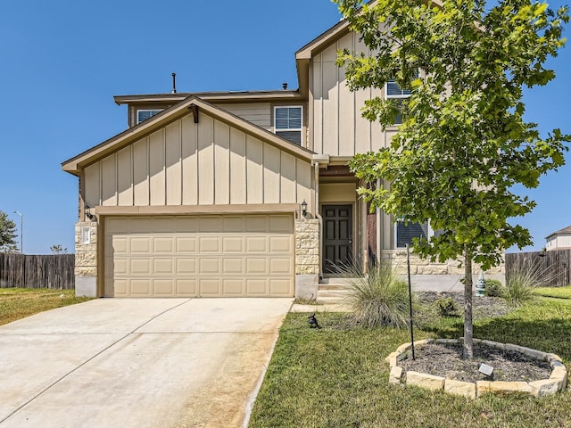 craftsman-style home featuring a front yard and a garage