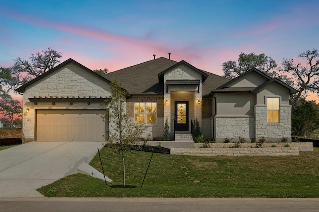 view of front facade featuring a garage and a lawn