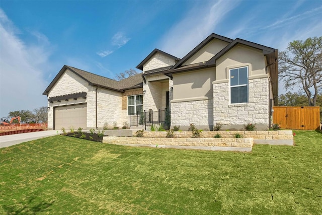 view of front facade with a garage and a front lawn