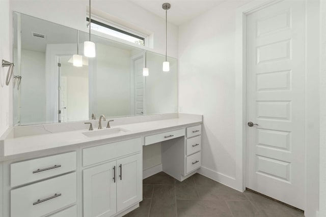 bathroom with tile patterned floors and vanity