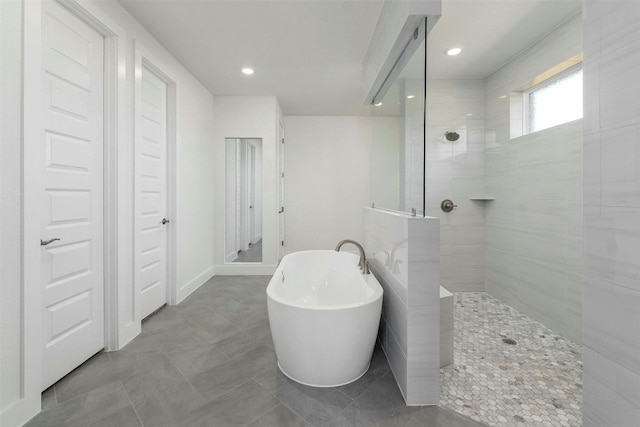 bathroom with plus walk in shower and tile patterned floors