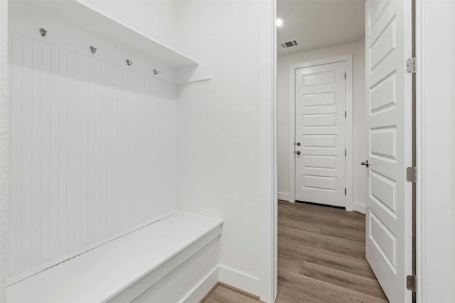 mudroom with light hardwood / wood-style floors