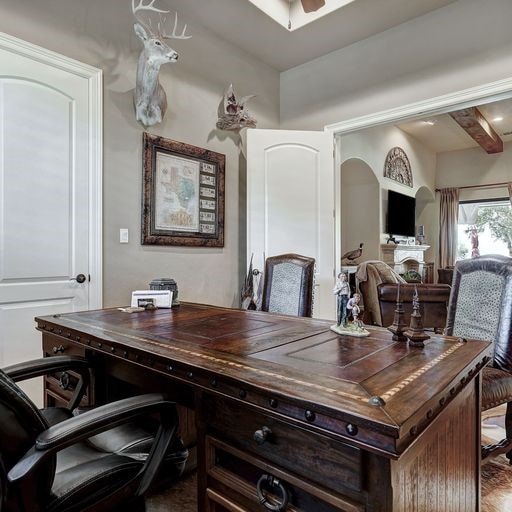 home office with beam ceiling