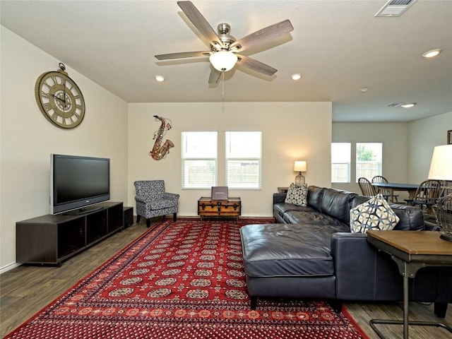 living room with hardwood / wood-style floors and ceiling fan