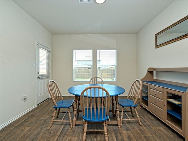 dining area with dark hardwood / wood-style floors