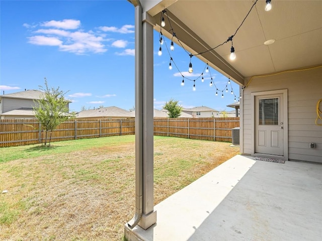 view of yard featuring a patio area and central air condition unit