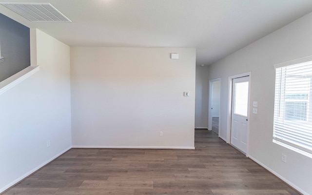 empty room with hardwood / wood-style flooring