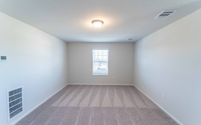 empty room with carpet flooring