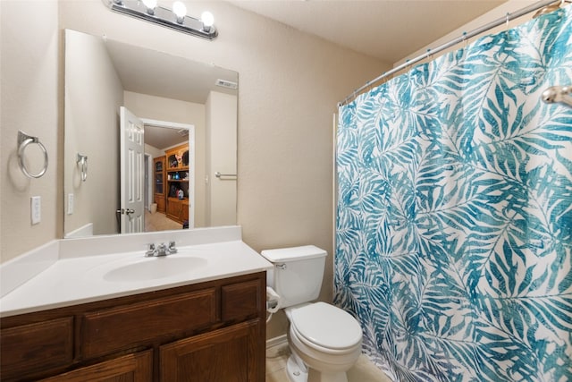 bathroom with oversized vanity, toilet, and tile floors