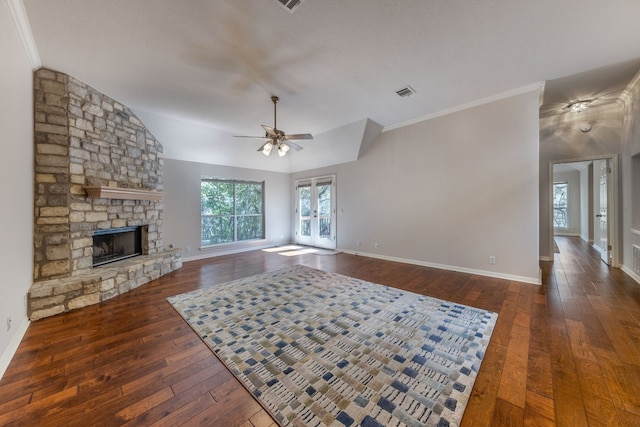 unfurnished living room featuring ornamental molding, ceiling fan, dark hardwood / wood-style floors, and a fireplace