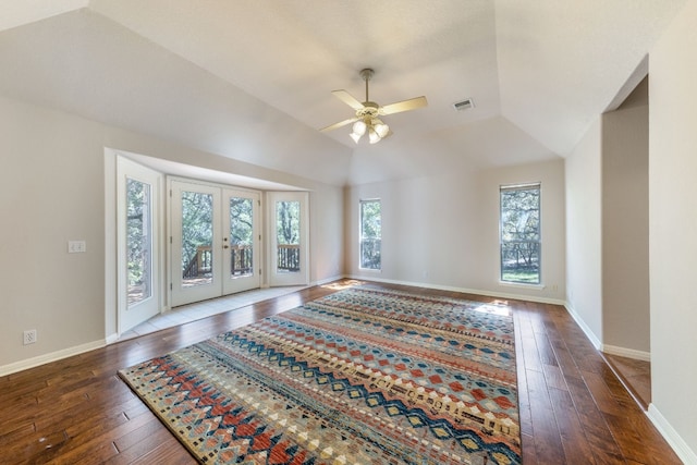 interior space with lofted ceiling, ceiling fan, dark hardwood / wood-style floors, and french doors