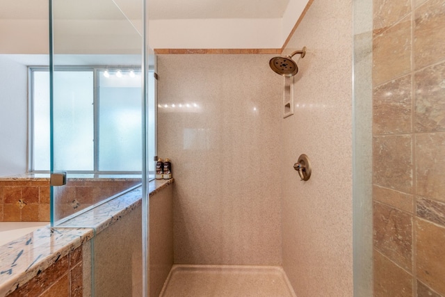 bathroom with tile walls and a tile shower