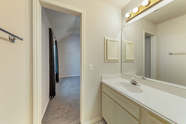 bathroom with oversized vanity and vaulted ceiling