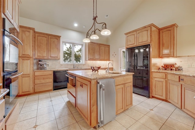 kitchen featuring backsplash, a kitchen island with sink, pendant lighting, and black appliances