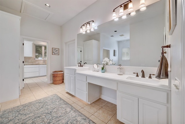 bathroom with tile patterned flooring and vanity