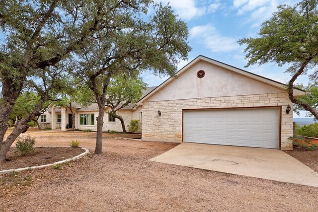 ranch-style home with a garage