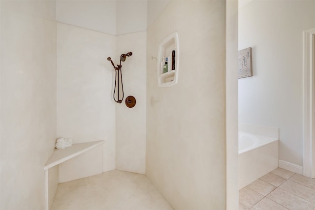 bathroom with tiled tub