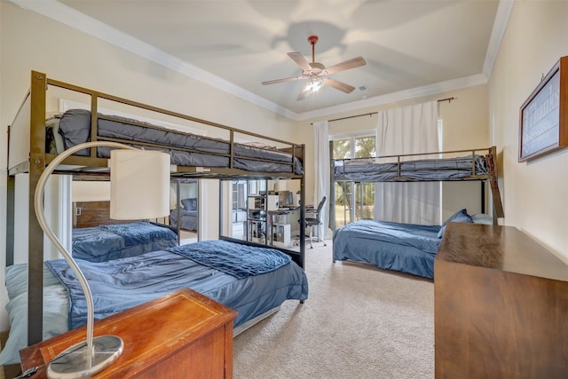 bedroom featuring ceiling fan, carpet floors, and crown molding