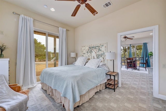 carpeted bedroom featuring multiple windows, access to exterior, and ceiling fan