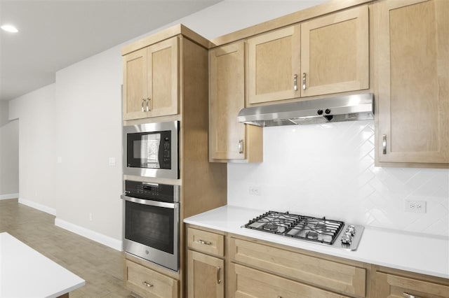 kitchen with stainless steel appliances and light brown cabinets