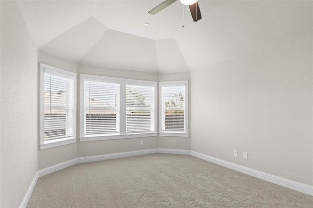 carpeted empty room featuring lofted ceiling and ceiling fan