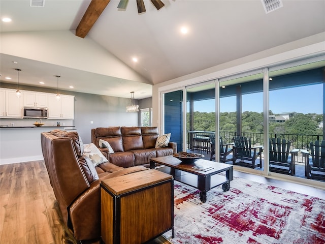 living room with beam ceiling, high vaulted ceiling, light hardwood / wood-style flooring, and a chandelier