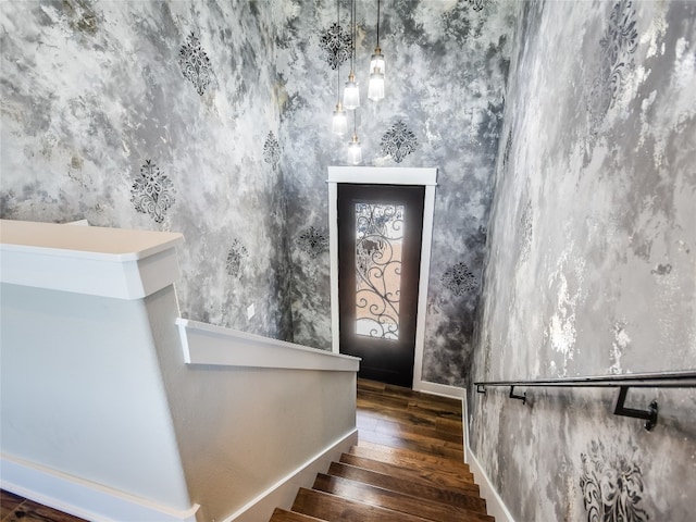 staircase with dark hardwood / wood-style flooring