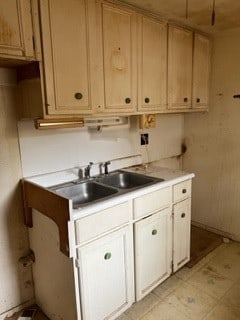 kitchen with light tile floors and sink