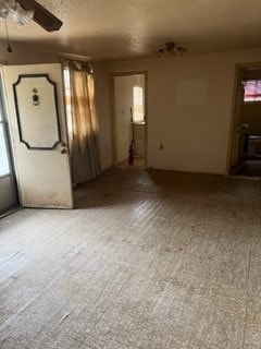 spare room with plenty of natural light and ceiling fan