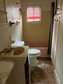 full bathroom with vanity, toilet, and washtub / shower combination