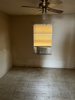 spare room with tile floors and ceiling fan