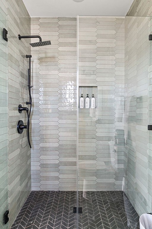 bathroom with tiled shower