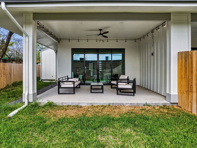 view of terrace with ceiling fan and outdoor lounge area